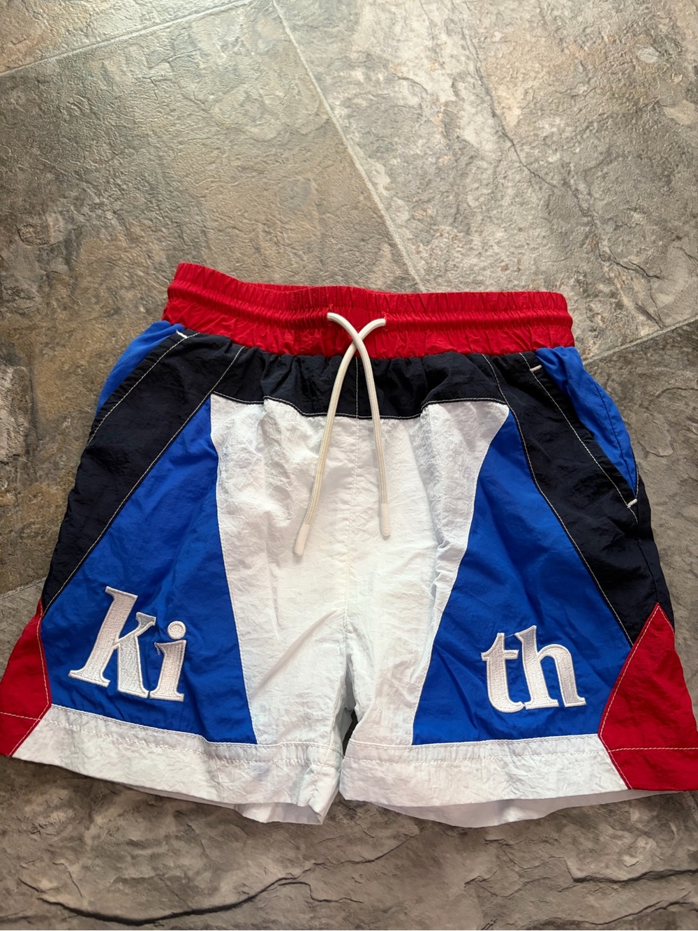 Kith swimming trunks size 4T 
Red/Blue/White
